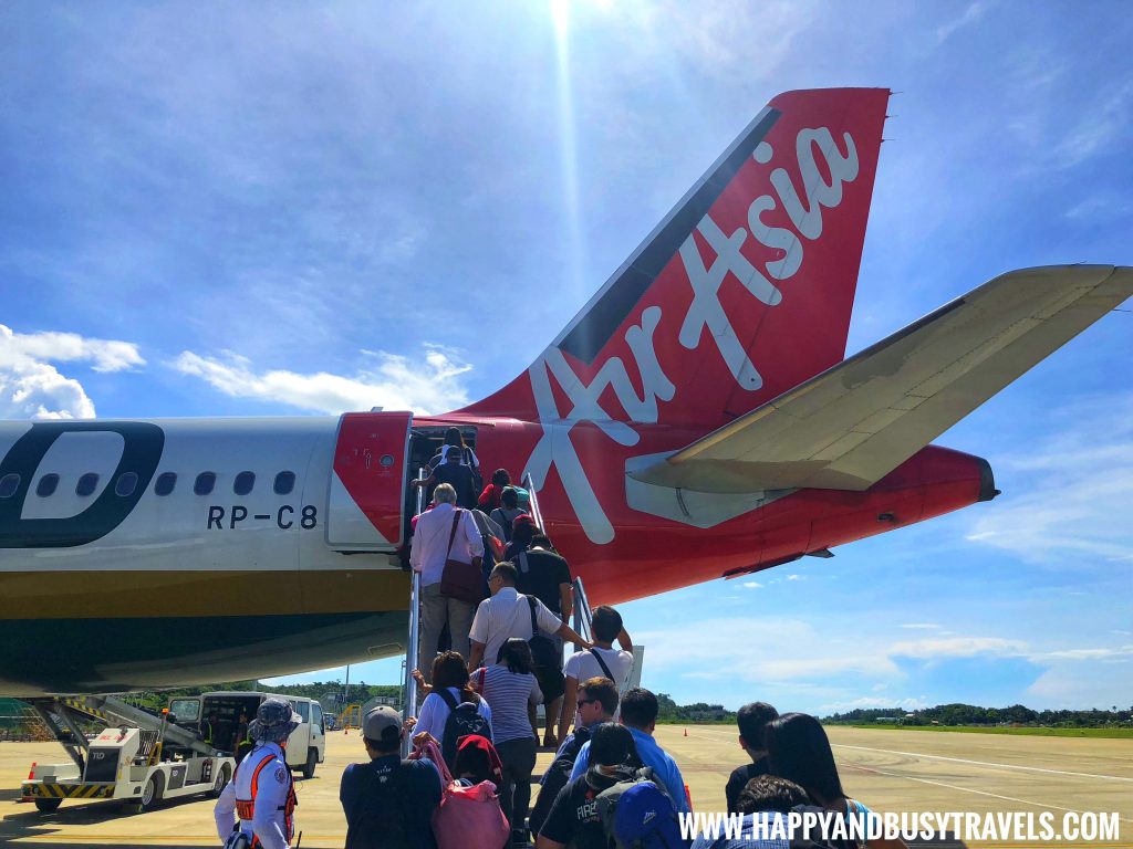 Riding the plane Air Asia - Happy and Busy Travels