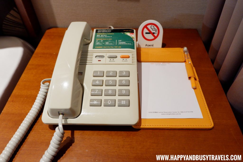 Telephone of the deluxe room of Orange Hotel Kaifong Happy and Busy Travels to Taiwan