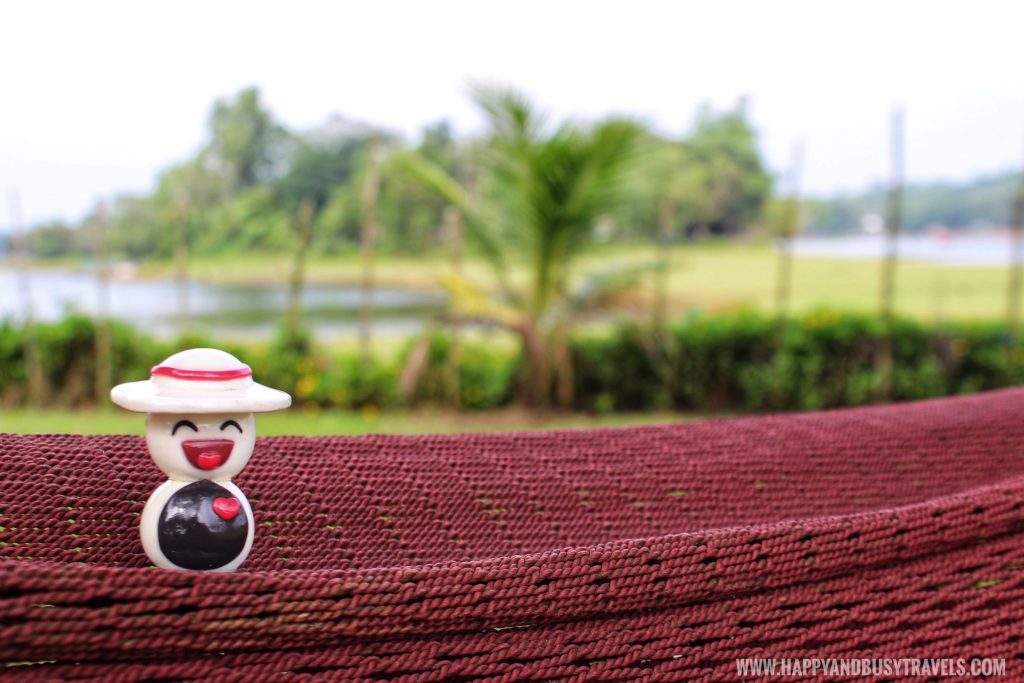 Hapsy relaxing on the duyan or hammock in the private island for rent in laguna