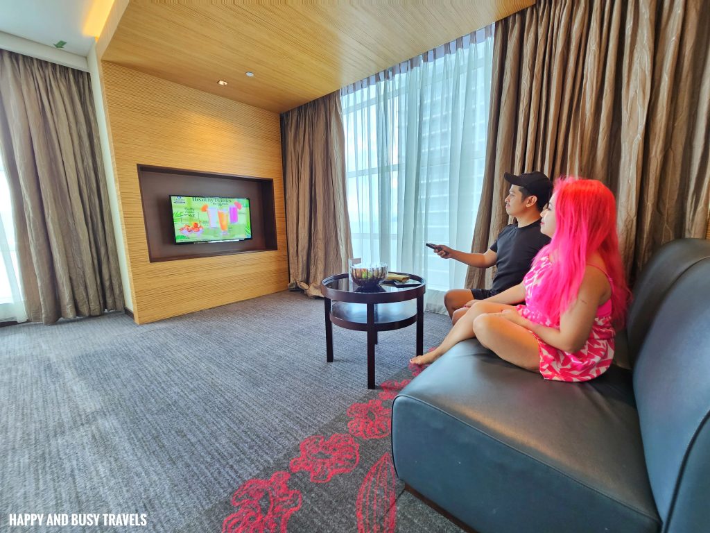 Grandis Hotels and Resorts 13 - Deluxe studio sea view room television and sofa Where to stay in Kota Kinabalu Sabah Malaysia near airport mall shopping - Happy and Busy Travels