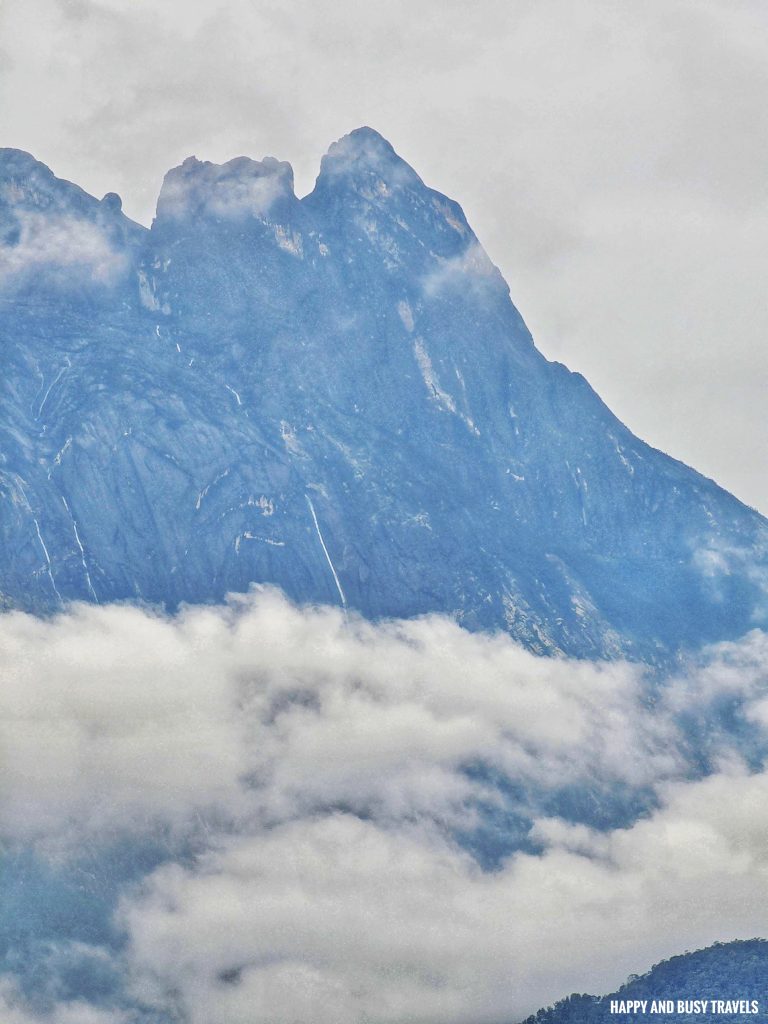 zoom in of mount kinabalu Nohutu Eco Tourism - Where to stay nature camp kota kinabalu sabah Malaysia view of mount kinabalu river - Happy and Busy Travels